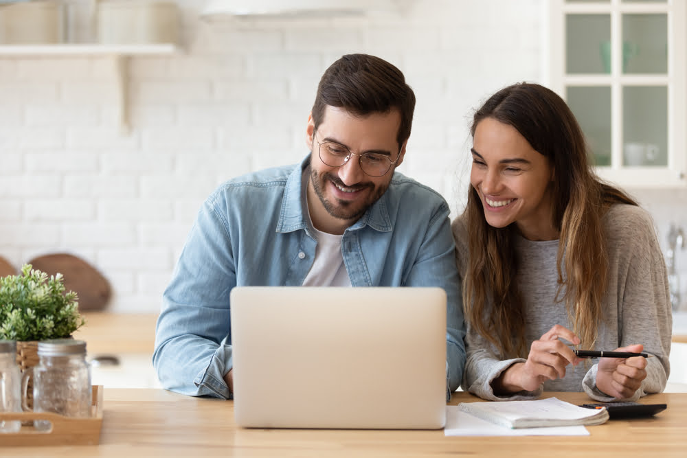 Young couple looking at computer